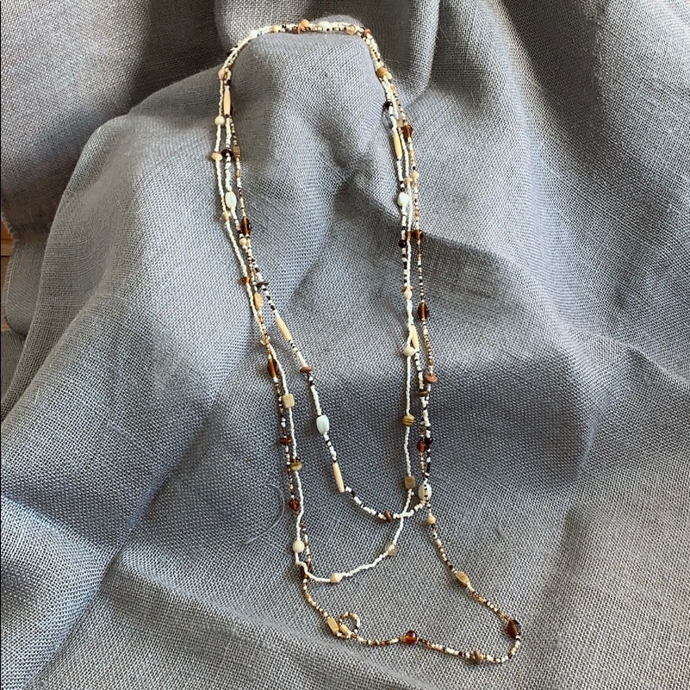 3 brown and white shell bead layering necklaces.